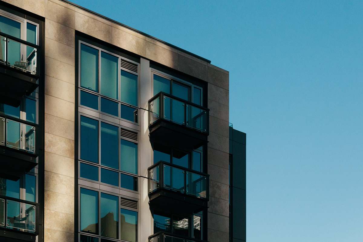 home decor gray concrete building during daytime office building